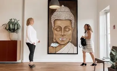 2 professional women meet in the lobby of the Pathway Legal offices in BC