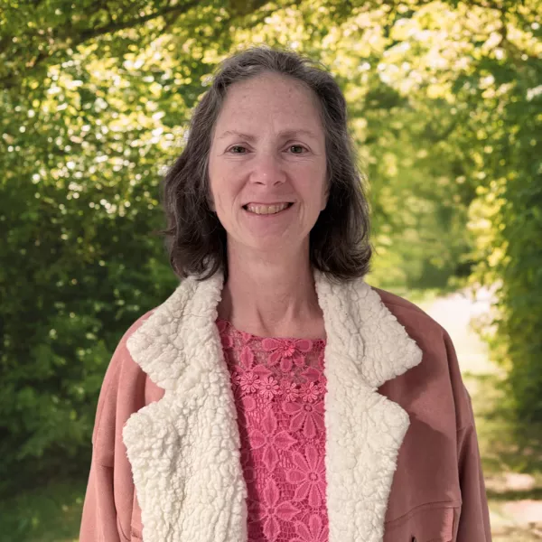 Daphne Jolley, Receptionist at Pathway Legal, wearing a fleece-lined coat. She warmly welcomes clients and supports intake with compassion and care.